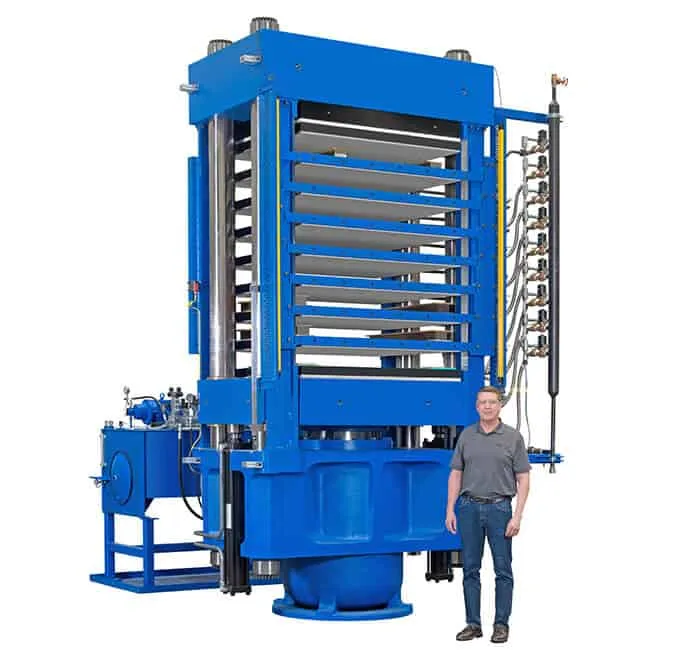 Man Standing Beside Rubber Molding Press