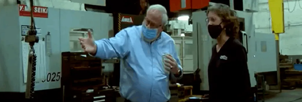 Workers Discussing Display