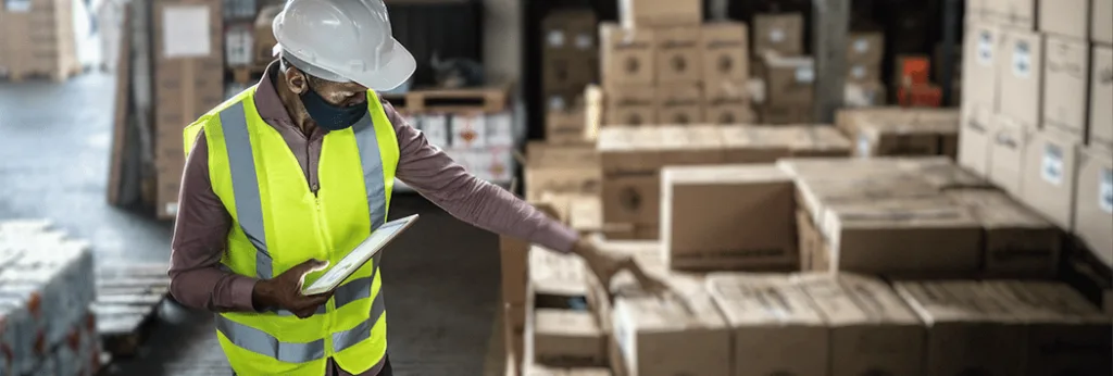 Worker Stacking Boxes