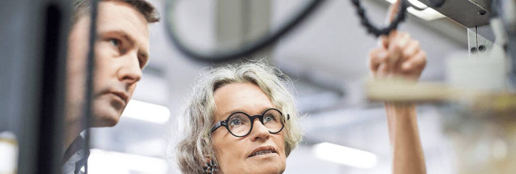 Workers Checking Out Automated Press