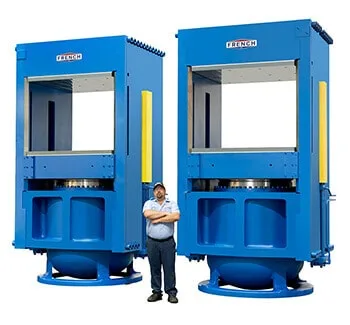 Man Standing Between French Hydraulic Press System