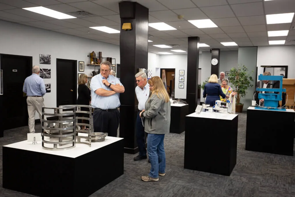 People looking at an exhibit at French Oil.