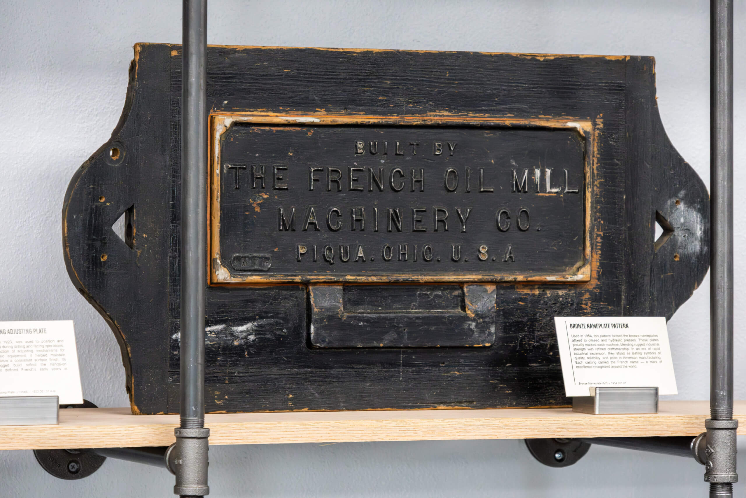 bronze_french_oil_nameplate Foundry pattern marked M7 for casting bronze French Oil nameplates, in The French Museum.