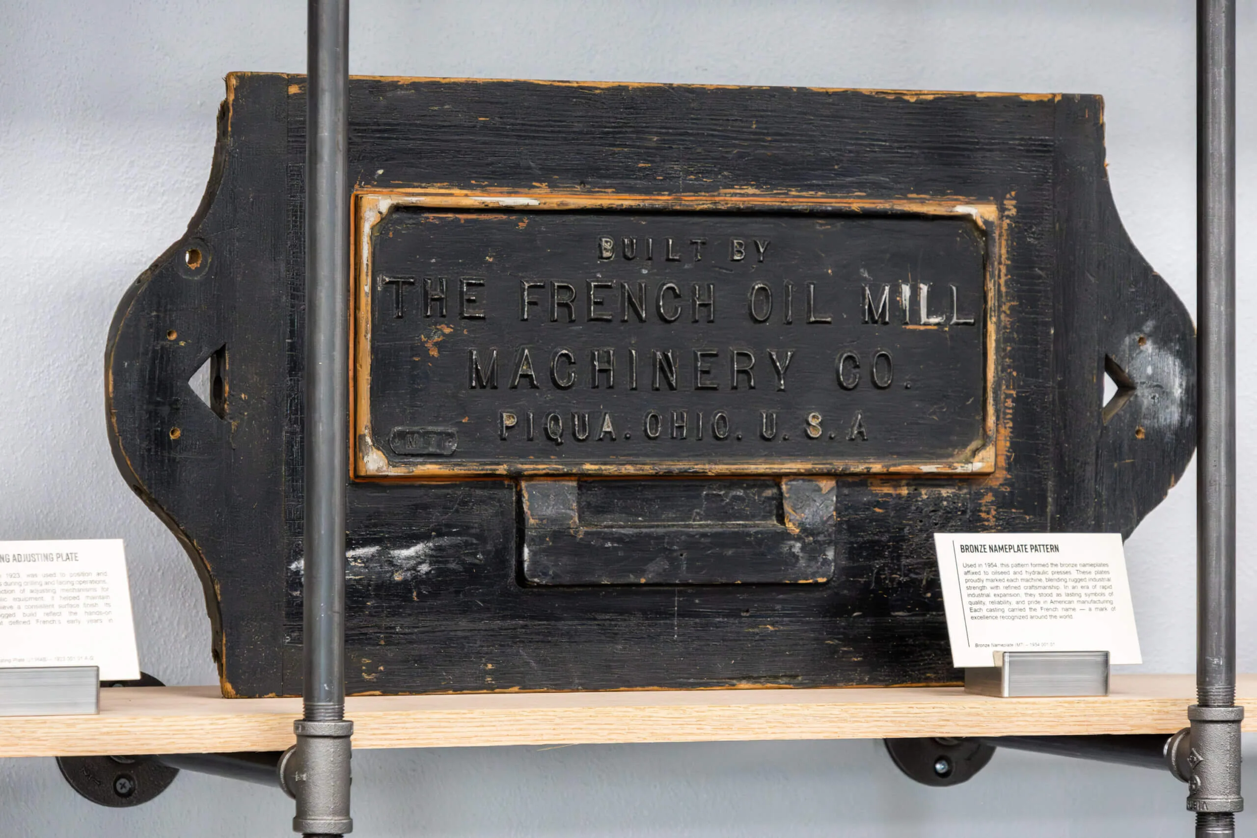 bronze_french_oil_nameplate Foundry pattern marked M7 for casting bronze French Oil nameplates, in The French Museum.